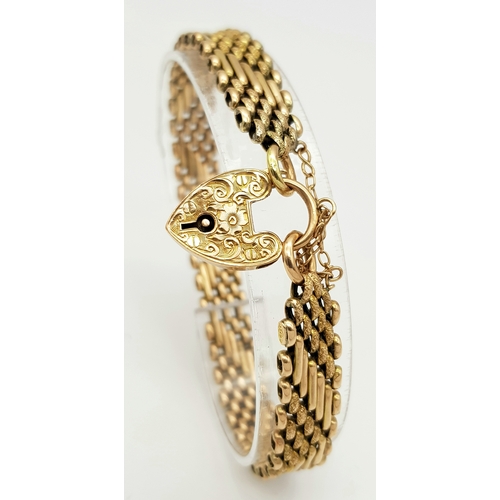 101 - A Lovely Vintage 9K Gold Intricate Link Patterned Bracelet with Heart Clasp. 18cm. 14.8g.