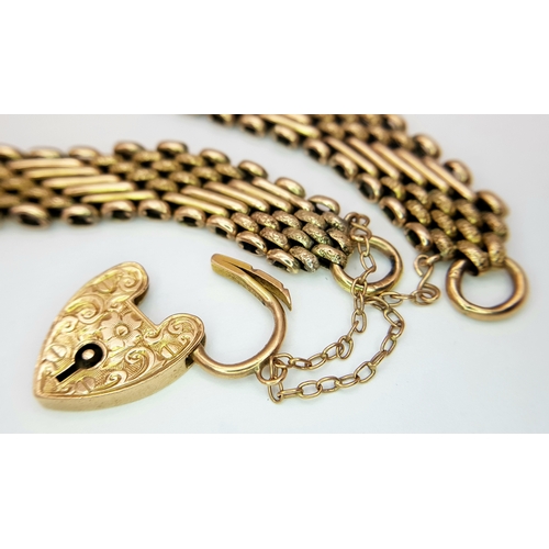 101 - A Lovely Vintage 9K Gold Intricate Link Patterned Bracelet with Heart Clasp. 18cm. 14.8g.