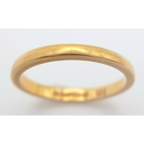 23 - A 22K GOLD BAND RING  ,    2.7gms    size K/L