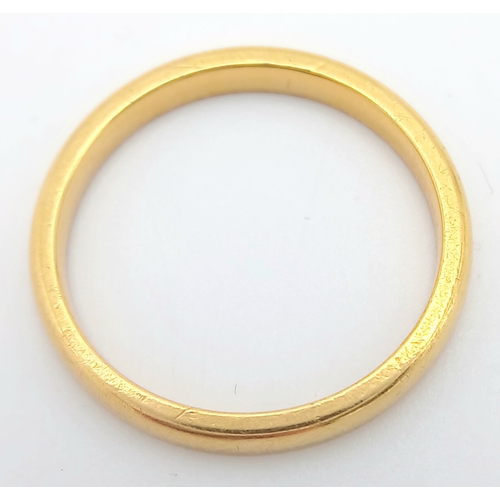 23 - A 22K GOLD BAND RING  ,    2.7gms    size K/L