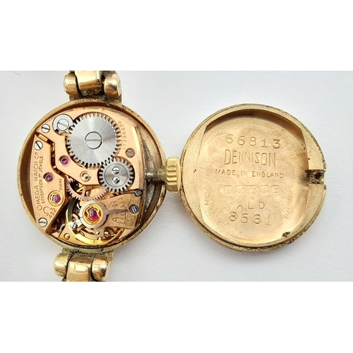 59 - A Vintage Omega 9K Gold Ladies Watch. 9k gold bracelet and case - 18mm. Patinaed dial. Mechanical, h... 