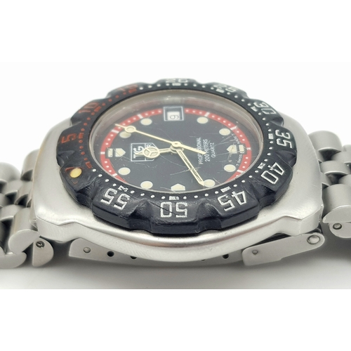 81 - A Vintage Tag Heuer Stainless Steel Formula 1 Midsize Watch. Case - 34mm. Black dial with date windo... 