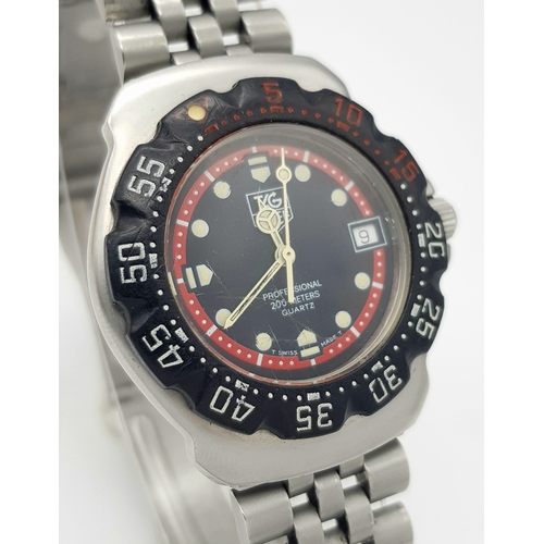 81 - A Vintage Tag Heuer Stainless Steel Formula 1 Midsize Watch. Case - 34mm. Black dial with date windo... 