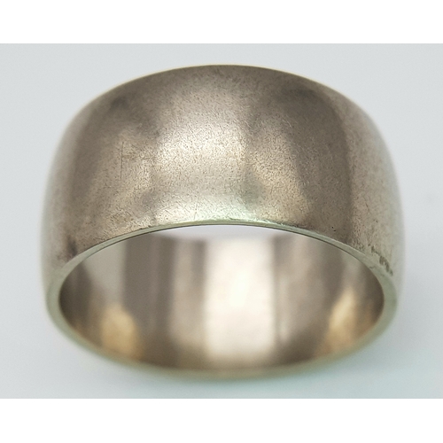 74 - A 9K White Gold Band Ring. 9mm width. Size N. 7.19g. R-6152571.