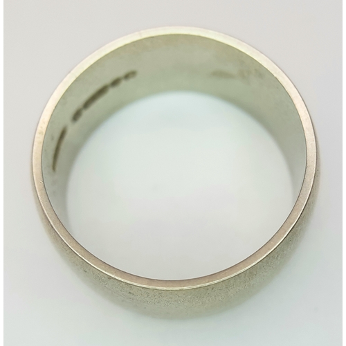 74 - A 9K White Gold Band Ring. 9mm width. Size N. 7.19g. R-6152571.