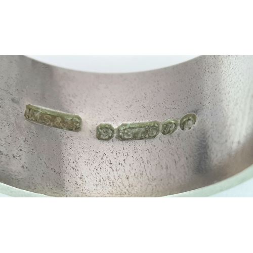74 - A 9K White Gold Band Ring. 9mm width. Size N. 7.19g. R-6152571.