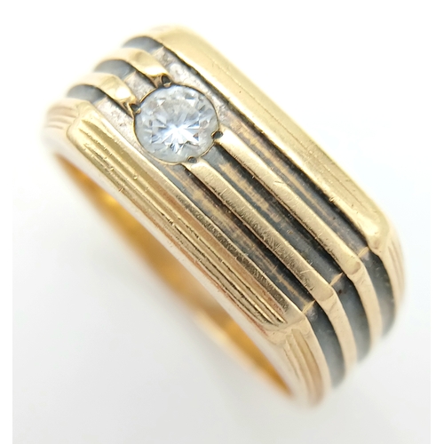 125 - A Stylish 14K Gold 'Le Mans' Diamond Signet Ring. 0.20ct round brilliant cut. Size R. 8.2g.