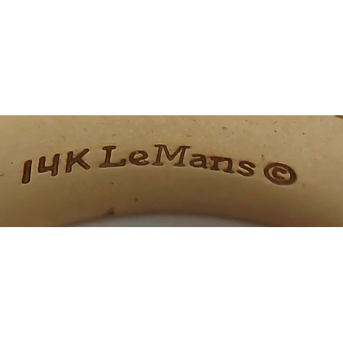 125 - A Stylish 14K Gold 'Le Mans' Diamond Signet Ring. 0.20ct round brilliant cut. Size R. 8.2g.