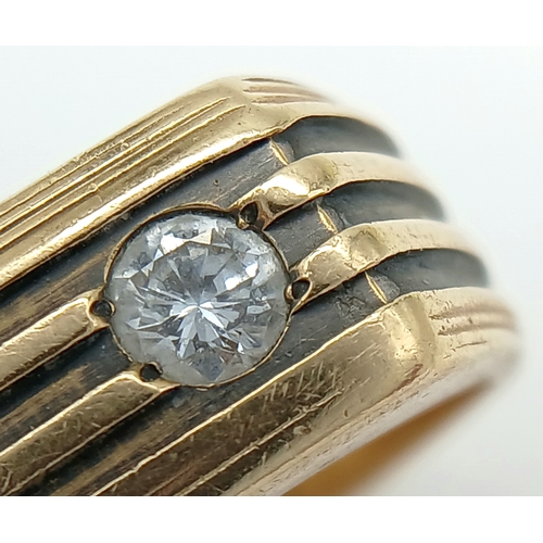 125 - A Stylish 14K Gold 'Le Mans' Diamond Signet Ring. 0.20ct round brilliant cut. Size R. 8.2g.