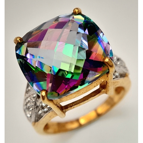 132 - A 9K Yellow Gold Mystic Topaz Ring. 11.808ct, Brazilian Antique cut centre stone with white topaz ac... 
