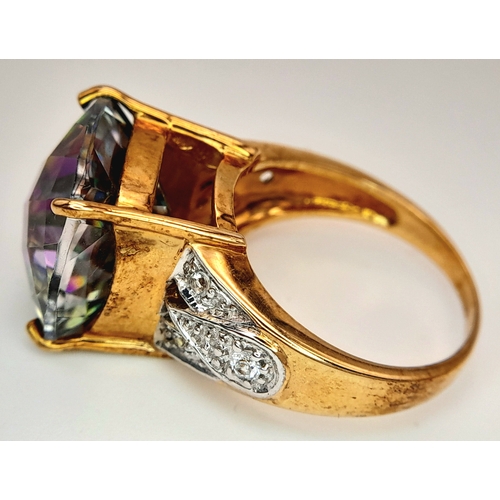 132 - A 9K Yellow Gold Mystic Topaz Ring. 11.808ct, Brazilian Antique cut centre stone with white topaz ac... 