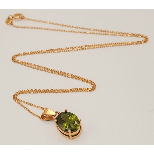 174 - An 18K Yellow Gold and Peridot Pendant on an 18K Yellow Gold Disappearing Necklace. 15mm and 42cm. 2... 