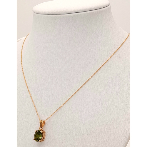 174 - An 18K Yellow Gold and Peridot Pendant on an 18K Yellow Gold Disappearing Necklace. 15mm and 42cm. 2... 
