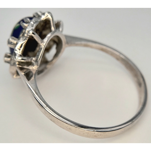 151 - An 18K WHITE GOLD FANCY FLORAL DESIGN DIAMOND SET RING. BEAUTIFUL PIECE. 4.7G TOTAL WEIGHT, SIZE R 1... 