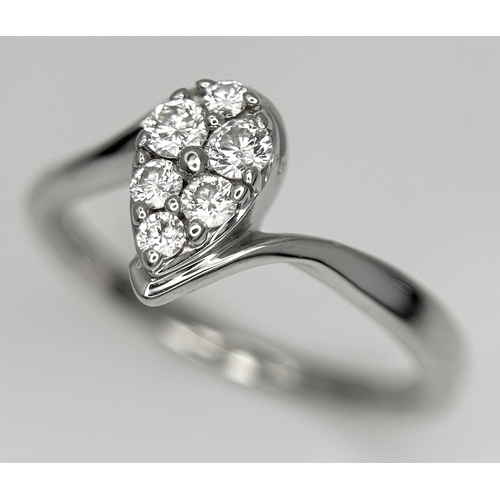 144 - AN 18K WHITE GOLD DIAMOND SET, PEAR SHAPED CROSSOVER RING. 0.25CTW. 3.7G. SIZE P. SC-5086.