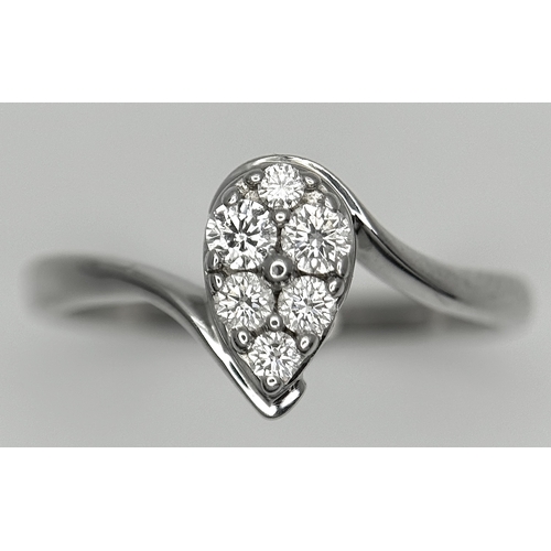 144 - AN 18K WHITE GOLD DIAMOND SET, PEAR SHAPED CROSSOVER RING. 0.25CTW. 3.7G. SIZE P. SC-5086.