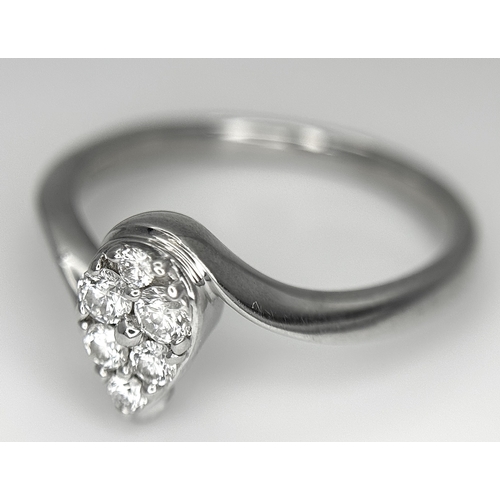 144 - AN 18K WHITE GOLD DIAMOND SET, PEAR SHAPED CROSSOVER RING. 0.25CTW. 3.7G. SIZE P. SC-5086.