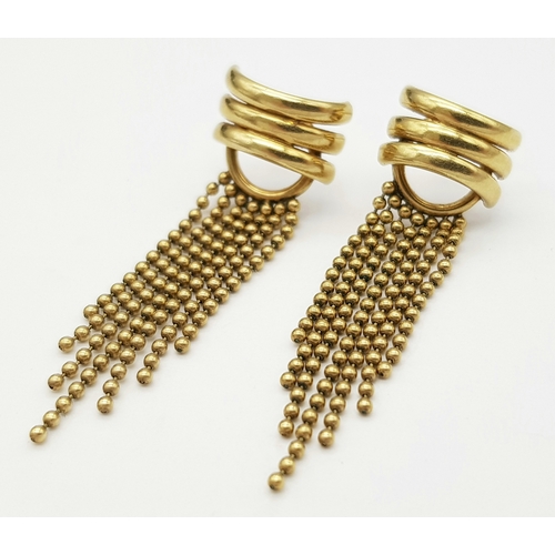 142 - A 9K Yellow Gold Pair of Flappers Earrings. No backs. 2.57g