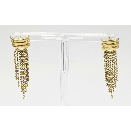 142 - A 9K Yellow Gold Pair of Flappers Earrings. No backs. 2.57g