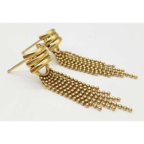 142 - A 9K Yellow Gold Pair of Flappers Earrings. No backs. 2.57g