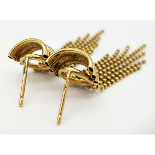 142 - A 9K Yellow Gold Pair of Flappers Earrings. No backs. 2.57g