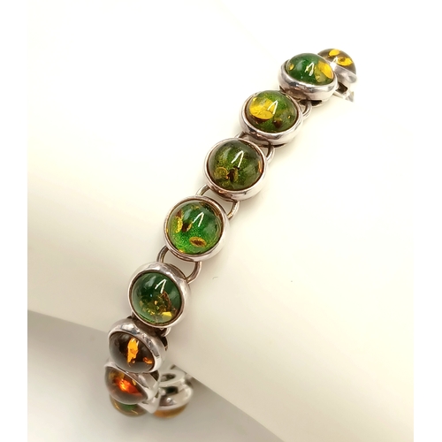 175 - Beautiful SILVER TENNIS BRACELET set with GREEN and AMBER COLOURED MOONSTONE. Full UK hallmark. 19.5... 