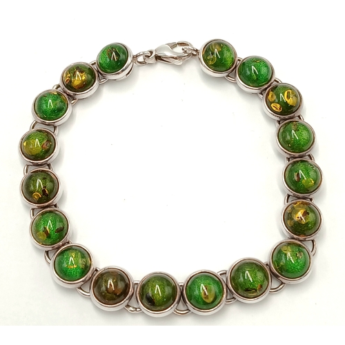 175 - Beautiful SILVER TENNIS BRACELET set with GREEN and AMBER COLOURED MOONSTONE. Full UK hallmark. 19.5... 