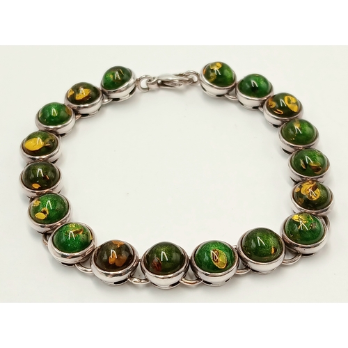 175 - Beautiful SILVER TENNIS BRACELET set with GREEN and AMBER COLOURED MOONSTONE. Full UK hallmark. 19.5... 