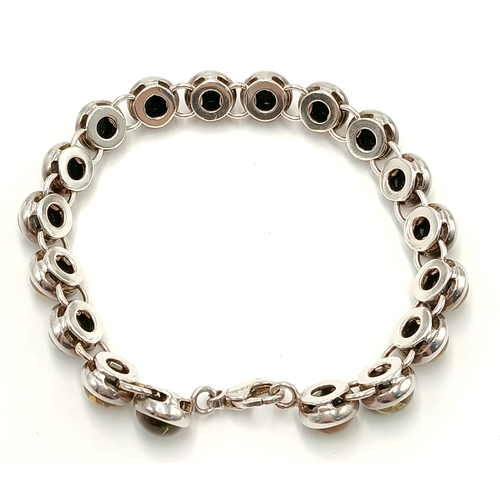 175 - Beautiful SILVER TENNIS BRACELET set with GREEN and AMBER COLOURED MOONSTONE. Full UK hallmark. 19.5... 