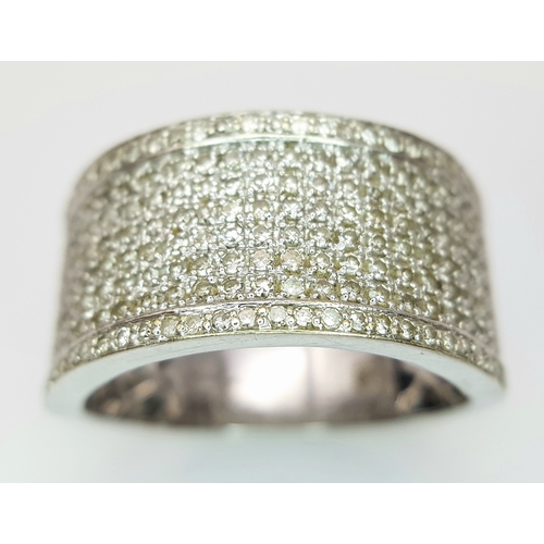 163 - A Gorgeous 18K White Gold and Diamond Cocktail Ring. Eight rows of pave diamonds - 1ctw. 12mm width.... 