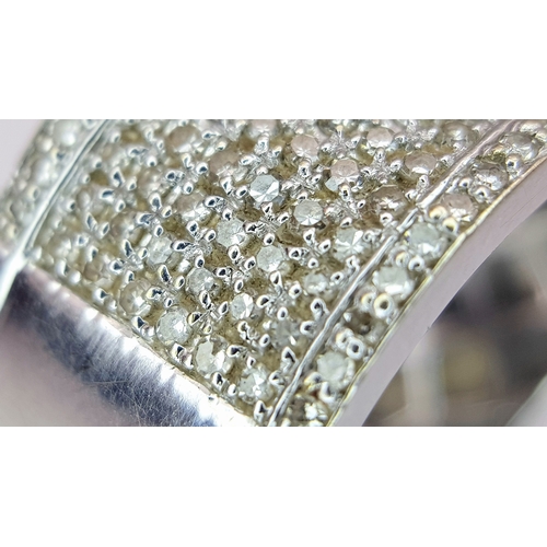 163 - A Gorgeous 18K White Gold and Diamond Cocktail Ring. Eight rows of pave diamonds - 1ctw. 12mm width.... 