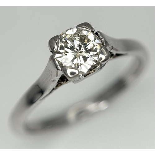 170 - An 18K White Gold Diamond Solitaire Ring. 0.50ct round brilliant cut diamond. SI1, Slightly champagn... 