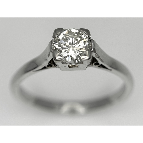 170 - An 18K White Gold Diamond Solitaire Ring. 0.50ct round brilliant cut diamond. SI1, Slightly champagn... 
