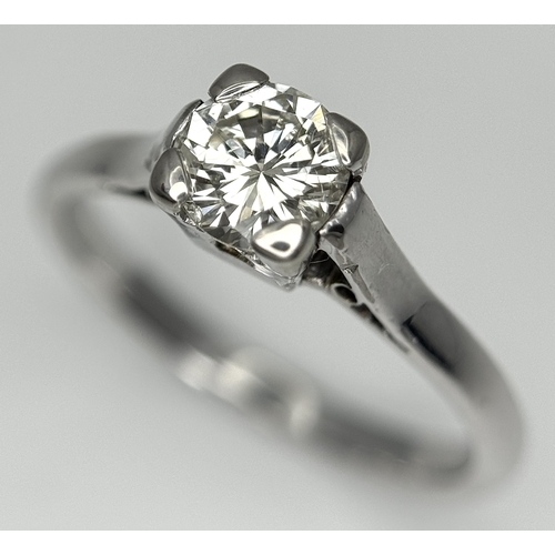 170 - An 18K White Gold Diamond Solitaire Ring. 0.50ct round brilliant cut diamond. SI1, Slightly champagn... 
