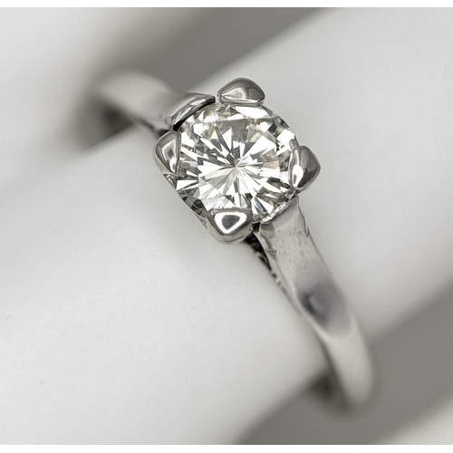 170 - An 18K White Gold Diamond Solitaire Ring. 0.50ct round brilliant cut diamond. SI1, Slightly champagn... 