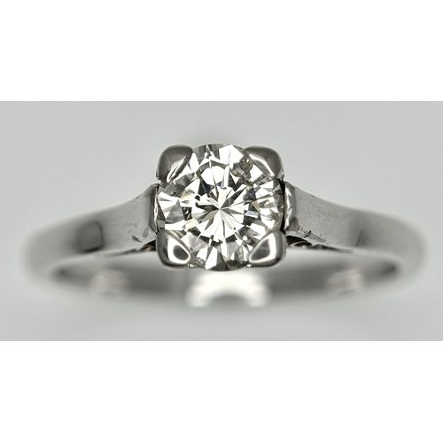 170 - An 18K White Gold Diamond Solitaire Ring. 0.50ct round brilliant cut diamond. SI1, Slightly champagn... 