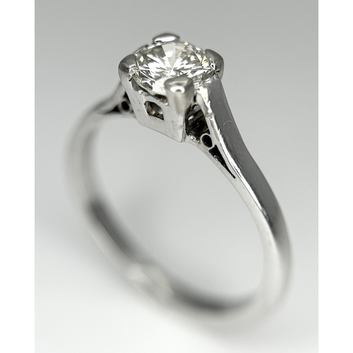 170 - An 18K White Gold Diamond Solitaire Ring. 0.50ct round brilliant cut diamond. SI1, Slightly champagn... 