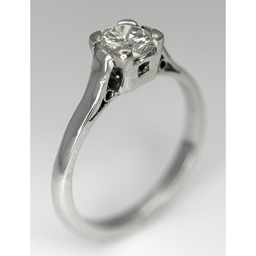 170 - An 18K White Gold Diamond Solitaire Ring. 0.50ct round brilliant cut diamond. SI1, Slightly champagn... 