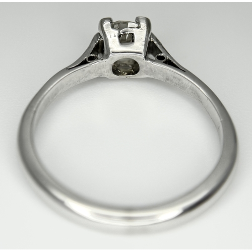 170 - An 18K White Gold Diamond Solitaire Ring. 0.50ct round brilliant cut diamond. SI1, Slightly champagn... 