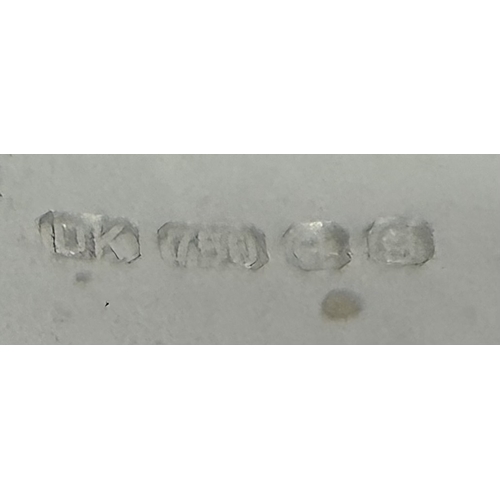 988 - An 18K White Gold, Royal Ruby and Diamond Ring. A 5.038 Madagascan oval cut Royal ruby with 0.084ctw... 