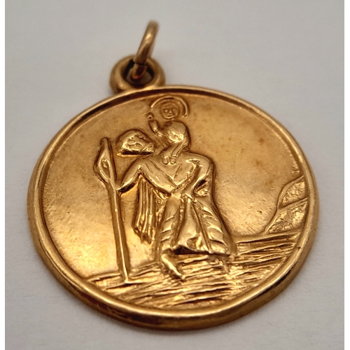 176 - A 9K Yellow Gold St. Christopher Pendant. 2cm. 2.77g