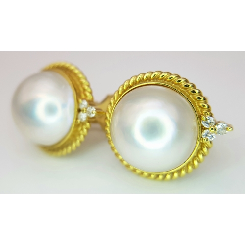 155 - A Pair of 18K Yellow Gold, Mabe Pearl and Diamond Earrings. Beautiful pearl cabochons each with thre... 