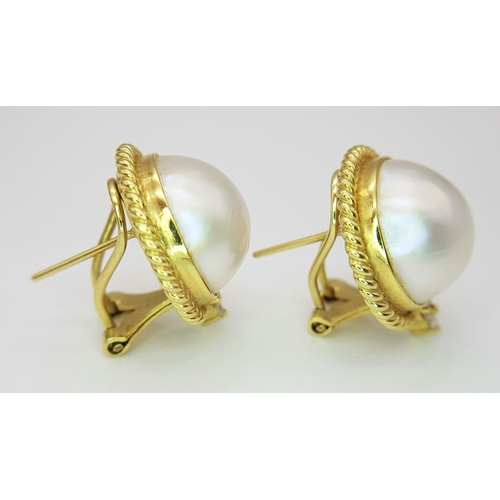 155 - A Pair of 18K Yellow Gold, Mabe Pearl and Diamond Earrings. Beautiful pearl cabochons each with thre... 