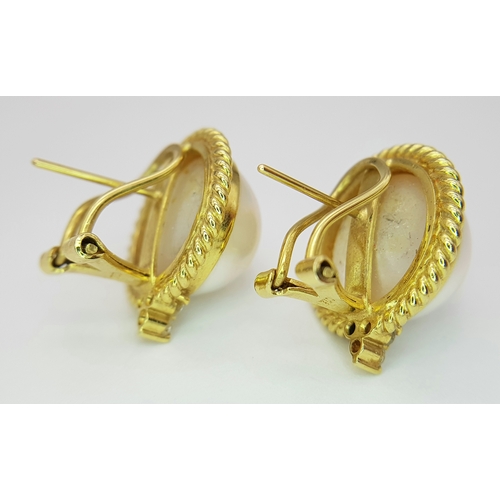 155 - A Pair of 18K Yellow Gold, Mabe Pearl and Diamond Earrings. Beautiful pearl cabochons each with thre... 