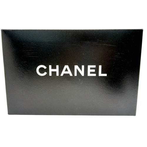 60 - A Chanel Black and Grey Tweed Flap Bag. Wool tweed exterior with gold-toned hardware, chain top hand... 