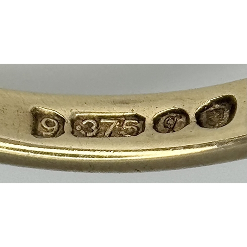 161 - An impressive 9 CARAT GOLD GARNET DRESS RING. 4 .7 Grams. Size M.