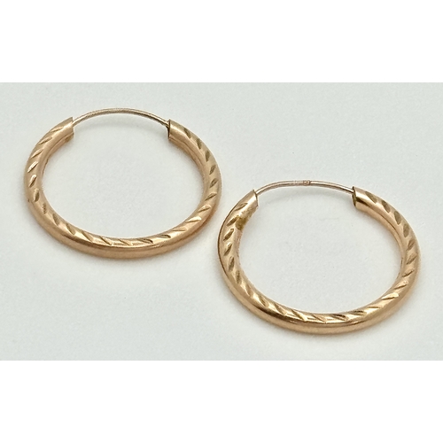 175 - Classic Pair of 9 CARAT ‘ROSE GOLD’ HOOP EARRINGS. Patterned Side Detail.  0.8 Grams. 2 cm Diameter.