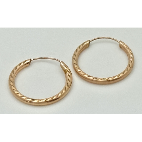 175 - Classic Pair of 9 CARAT ‘ROSE GOLD’ HOOP EARRINGS. Patterned Side Detail.  0.8 Grams. 2 cm Diameter.