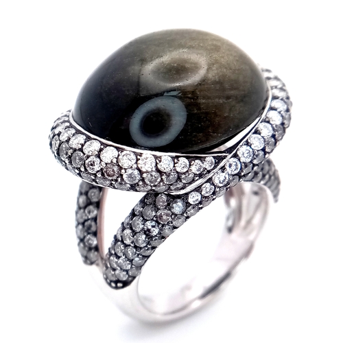 122 - A Head-Turning 18K White Gold, Diamond and Chrysoberyl (cat's eye) Ring. A large c.15ct chrysoberyl ... 