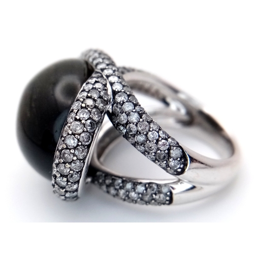 122 - A Head-Turning 18K White Gold, Diamond and Chrysoberyl (cat's eye) Ring. A large c.15ct chrysoberyl ... 